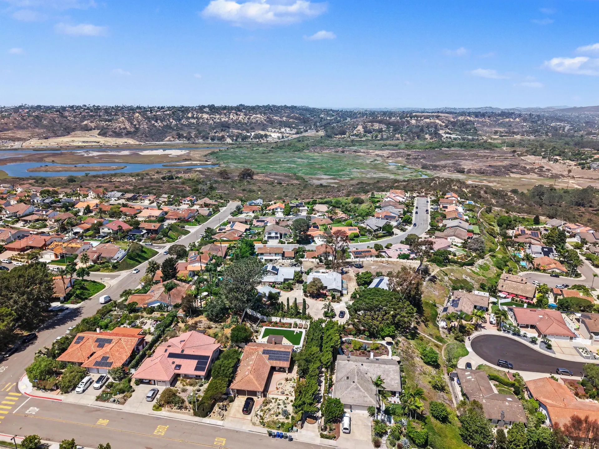 Aerial view north over the neighborhood toward the lagoon and the open reserve.