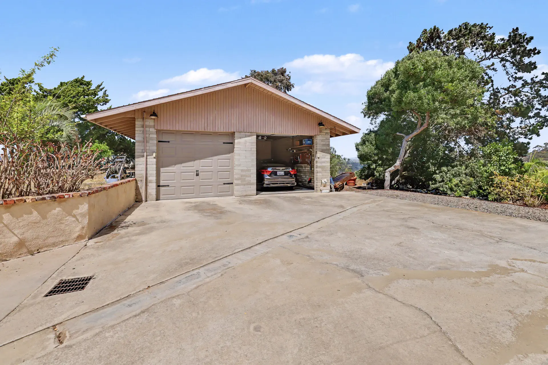 The detached garage opening onto the motor court.